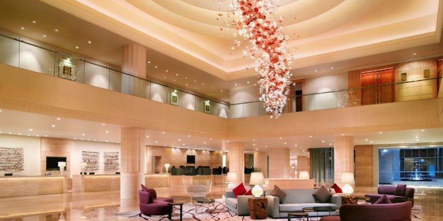 Hotel exterior showcasing modern architecture and welcoming entrance.